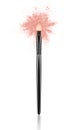 Beige make up brush with powder splash close-up