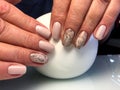 Beige manicure with fashionable design