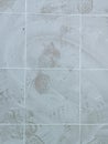 Beige marble wall texture wallpaper background. Just made repairs. Dirty tiles with footprints. Just laid tile. Repair Royalty Free Stock Photo