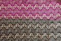 Beige openwork lace on a black-burgundy background