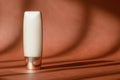 Makeup liquid foundation nude cream cosmetic bottle mockup on brown surface