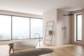 Beige panoramic bathroom with narrow window in shower area. Corner view