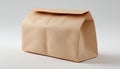Beige Paper Bag With A Rectangular Shape Resting On A White Surface Royalty Free Stock Photo