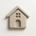 Beige plastic house icon with textured surface and shadow on a white background studio shot Royalty Free Stock Photo