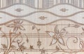 Beige porcelain tiles with floral patterns. Porcelain stoneware texture