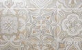 Beige porcelain tiles with ornament. Background and texture of porcelain tiles