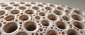 Beige Porous Object with Repeating Round Holes Close up Royalty Free Stock Photo