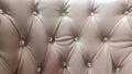 Beige quilted leather headboard seamless pattern, luxury soft leather background. Headboard, bed. Background texture of Royalty Free Stock Photo