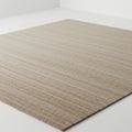 A beige, rectangular carpet is placed in a minimalist, white room with clean lines and Royalty Free Stock Photo
