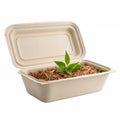 A beige, rectangular, eco-friendly compost container with a lid open Royalty Free Stock Photo