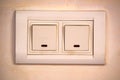 Beige rocker light switch with two buttons Royalty Free Stock Photo