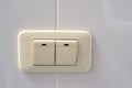 Beige rocker light switch with two buttons Royalty Free Stock Photo