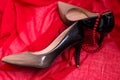 Patent leather shoes on a red background