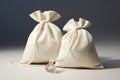 Beige silk fabric bags with laces for jewelry are on the table