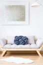 Beige sofa with blue pillow