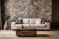 Beige sofa on hardwood floor near stone cladding wall. Minimalist style home interior design of modern living room