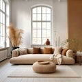 Beige sofa and terra cotta cushions in room with high ceiling an