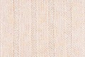 Beige soft knitted fabric texture with strips wale. Royalty Free Stock Photo