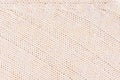 Beige soft knitted fabric texture with strips wale. Royalty Free Stock Photo