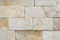 Beige stone wall with textured surface pattern. AI generative Royalty Free Stock Photo
