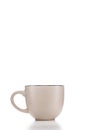 Beige stylish ceramic coffee Cup on white isolated background