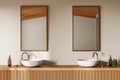 Beige stylish hotel bathroom interior with double sink, mirror and accessories Royalty Free Stock Photo