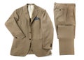 Beige suit with neatly folded pants and jacket