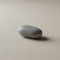 Beige surface. The stone is light gray with a polished texture, suggesting Royalty Free Stock Photo