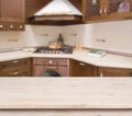 Beige table on defocused brown kitchen interior background Royalty Free Stock Photo