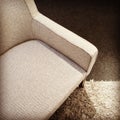 Beige textile armchair on a carpet