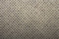 Beige texture in twisted mesh. Royalty Free Stock Photo