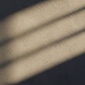 Beige textured wall with diagonal, soft shadows, creating a pattern across the Royalty Free Stock Photo