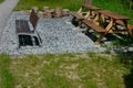 Beige threshing path gravel with delimited edges granite cubes in a row and dividing channels from the cube trough channel due to