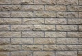 Beige tile cladded stone wall texture