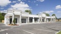 Beige toned commercial strip mall Royalty Free Stock Photo