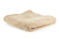 Beige towel isolated on a white Royalty Free Stock Photo