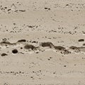 Beige travertine marble surface showcasing irregular holes and a textured Royalty Free Stock Photo