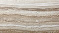 Beige travertine stone texture showcases warm natural surface with organic patterns, ideal for Royalty Free Stock Photo