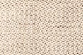 Beige vintage fabric with woven texture closeup. Textile macro background