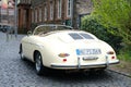 beige vintage porsche 356 Cabriolet, Retro luxury sports car which was first produced by Austrian company Porsche parked on street