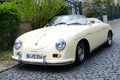 beige vintage porsche 356 Cabriolet, Retro luxury sports car which was first produced by Austrian company Porsche parked on street