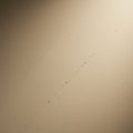 Beige wall with subtle diagonal cracks. The surface is smooth with faint lines that cre Royalty Free Stock Photo