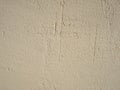 Beige wall texture background. Stucco pattern. Sand dabs plaster.