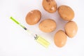 Beige, wild chicken eggs and a medical syringe on a white background. Selective focus. Copy space Royalty Free Stock Photo