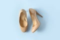 Beige women high heel shoes on pink background. Fashion blog look. Top view. View from above.