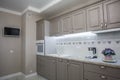 Beige wooden cupboards in modern kitchen