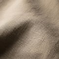 Beige woven fabric displaying a textured grainy surface with a Royalty Free Stock Photo