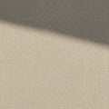 Beige woven fabric texture with a diagonal shadow cast across the surface. The Royalty Free Stock Photo