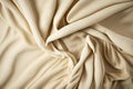 Beige woven textile drape background. Waving cloth fabric canvas