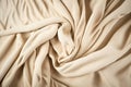 Beige woven textile drape background. Waving cloth fabric canvas